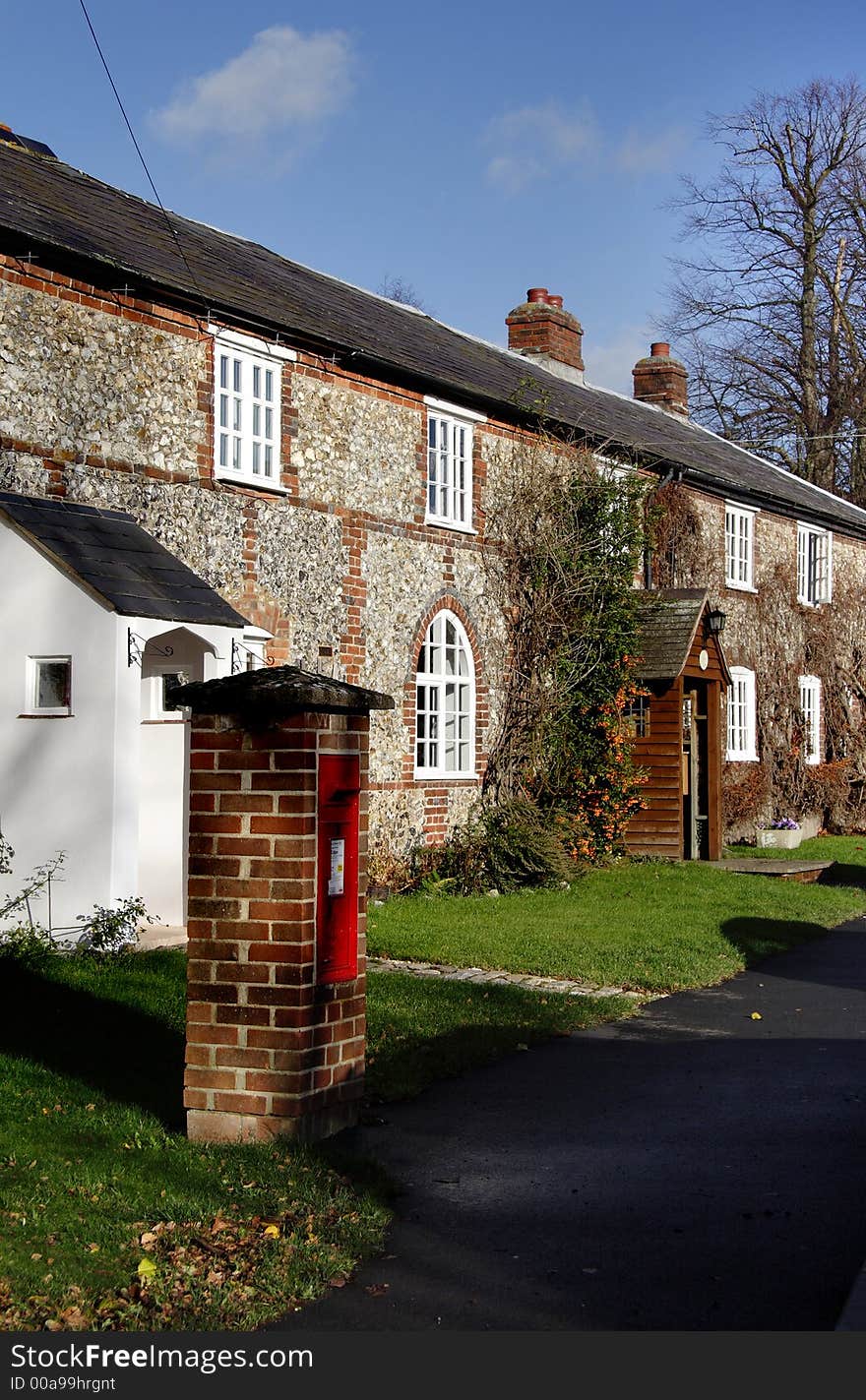 Quaint Row of Brick and Flint Cottages in a Rural Village Street in England. Quaint Row of Brick and Flint Cottages in a Rural Village Street in England