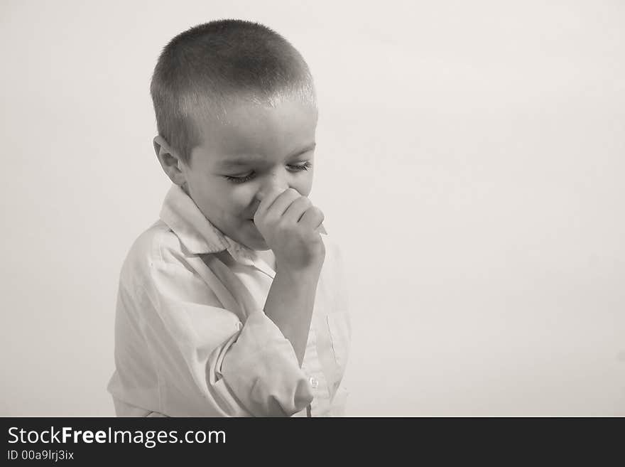 A small boy is sucking his thumb because his is upset