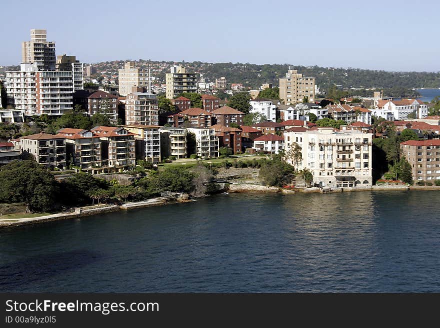 Buildings At The Sydney Harbour Coastline On A Summer Day. Buildings At The Sydney Harbour Coastline On A Summer Day