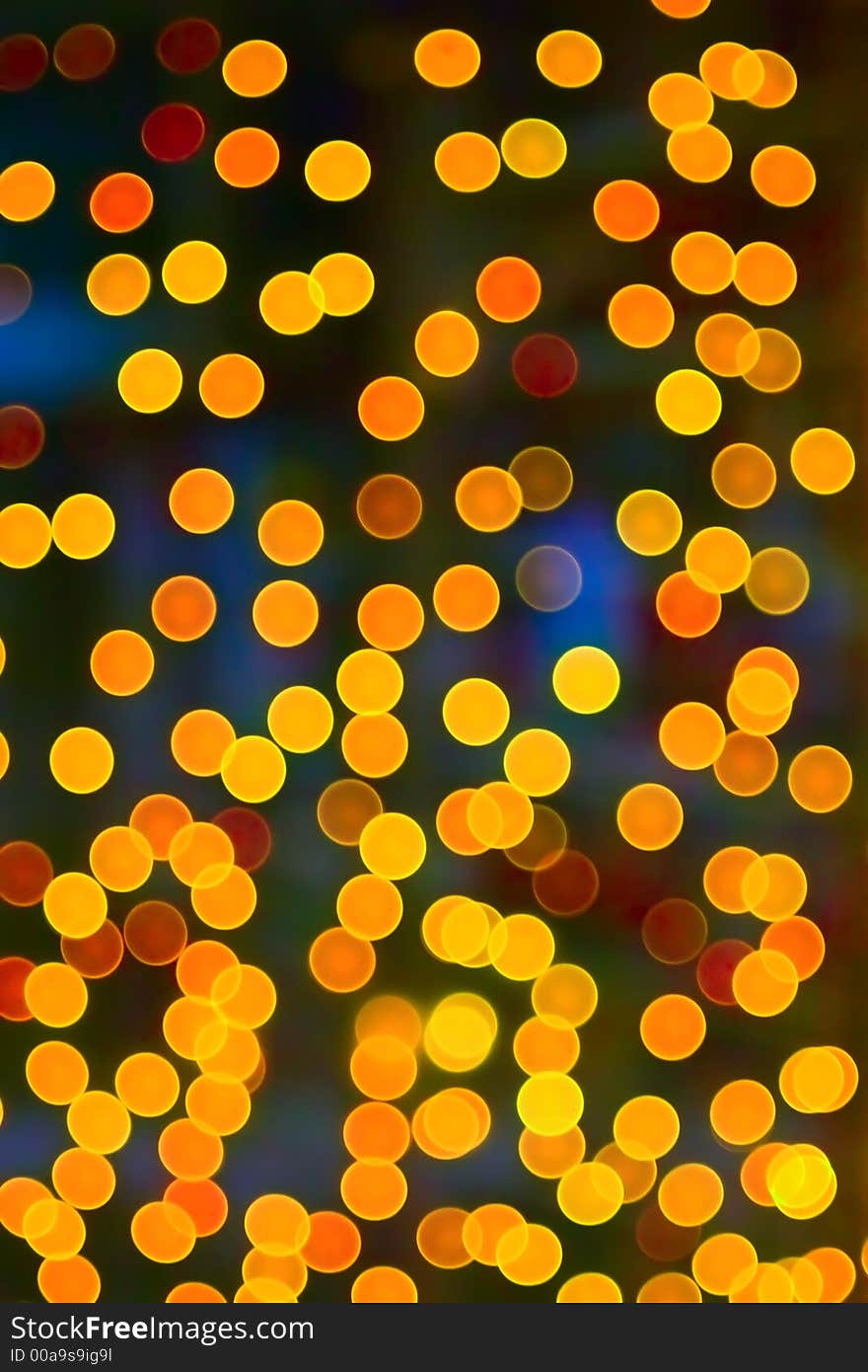 Brightly colored Christmas lights on a Christmas tree. Forced out of focus. Brightly colored Christmas lights on a Christmas tree. Forced out of focus.