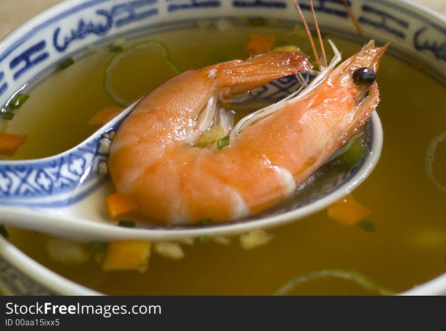 Cinese prawn soup in a bowl close up