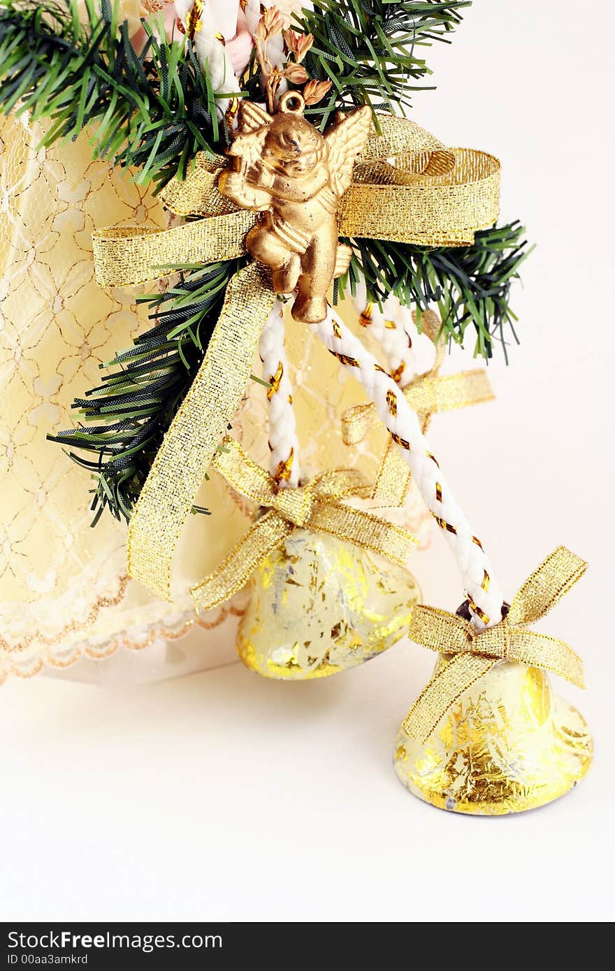 Christmas decoration - bells with green branch and bottom of the angel's dress