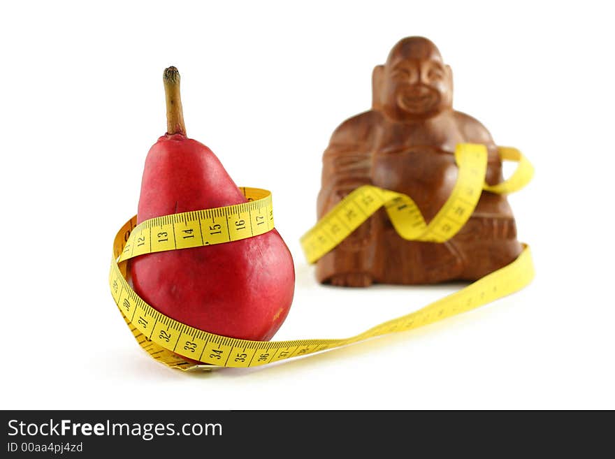 Red pear with fat budda and measuring tape, isolated on white