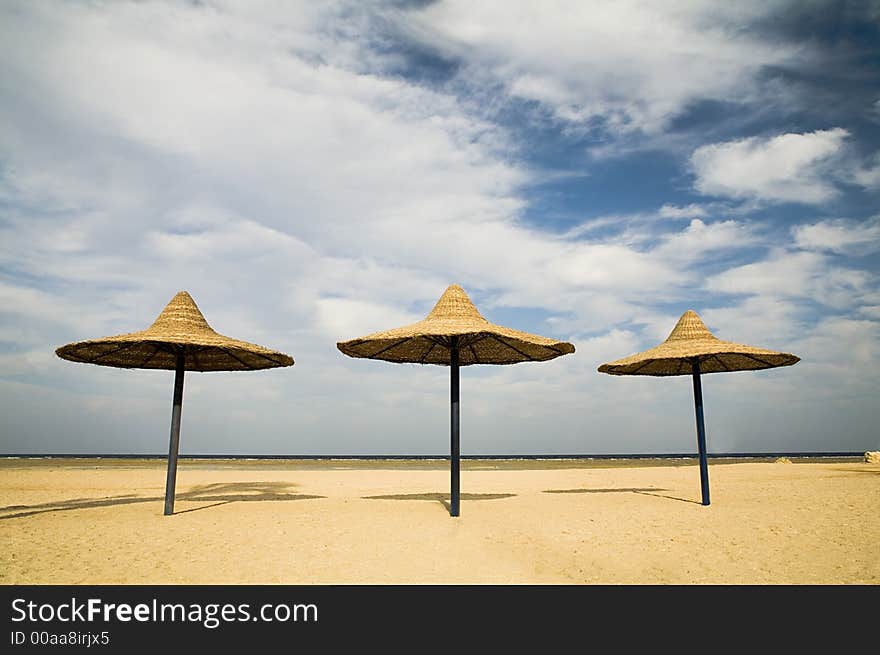 Parasols on a coast in the morning (while nobody has come)