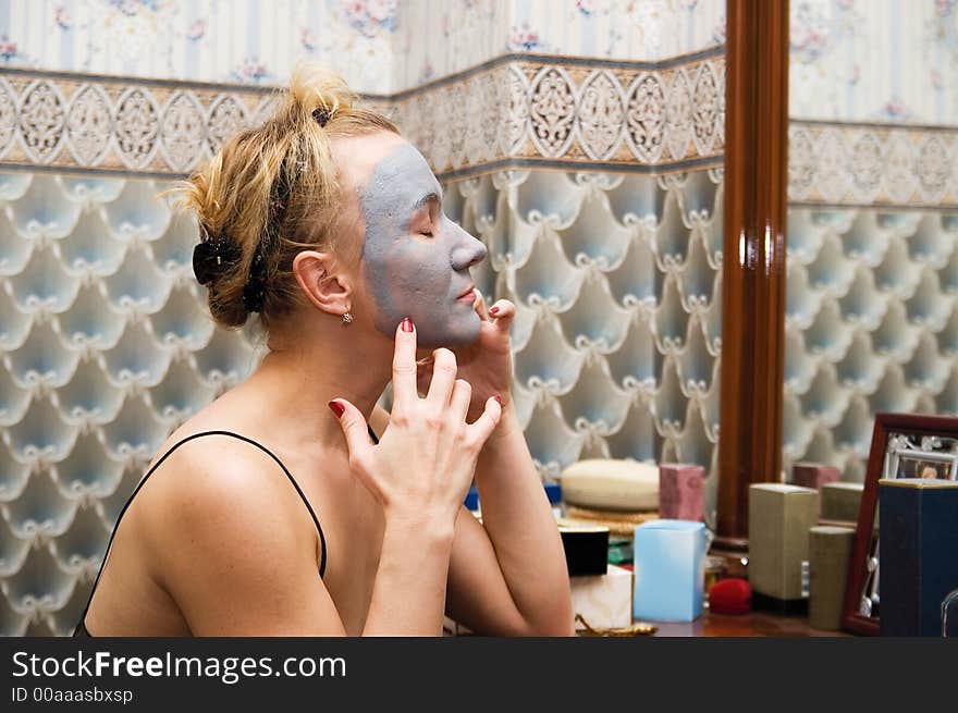 Funny woman with the cosmetic mask. Funny woman with the cosmetic mask