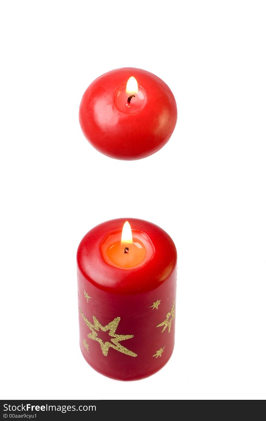 Two diferent candles on white background close up