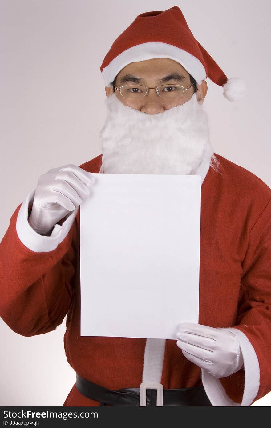 Asian santa claus holding a blank paper. Asian santa claus holding a blank paper.