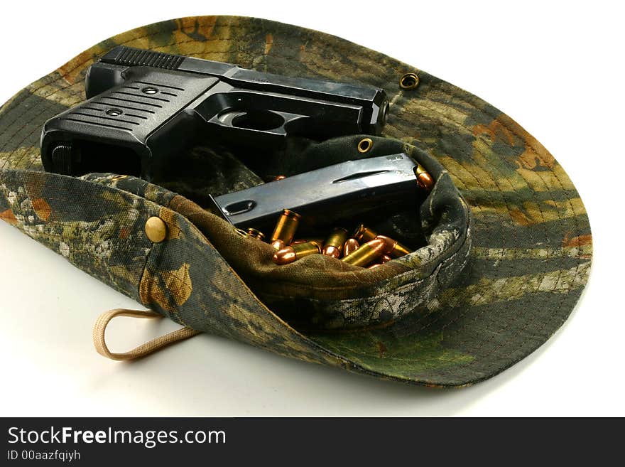 Handgun And Ammo In A Hat