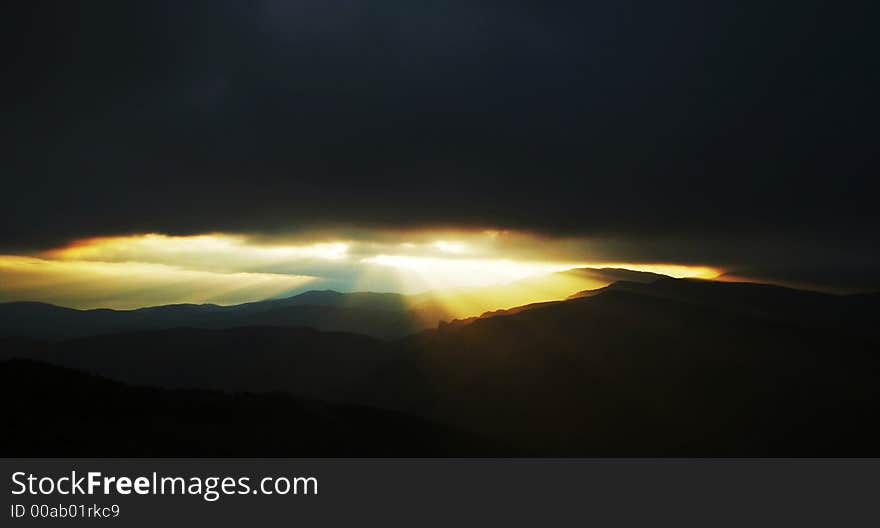 Colorful clouds and mountain silhouette. Colorful clouds and mountain silhouette