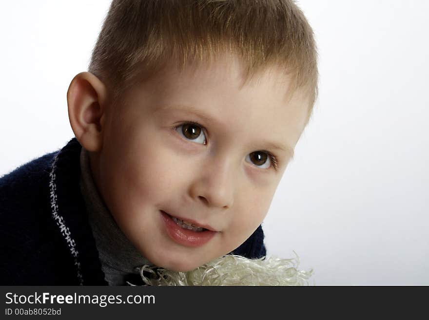 Four years old boy isolated looking up closeup