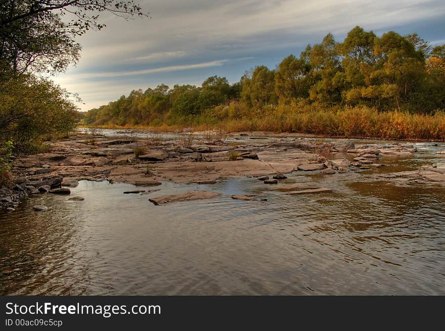 Taiga river with stones