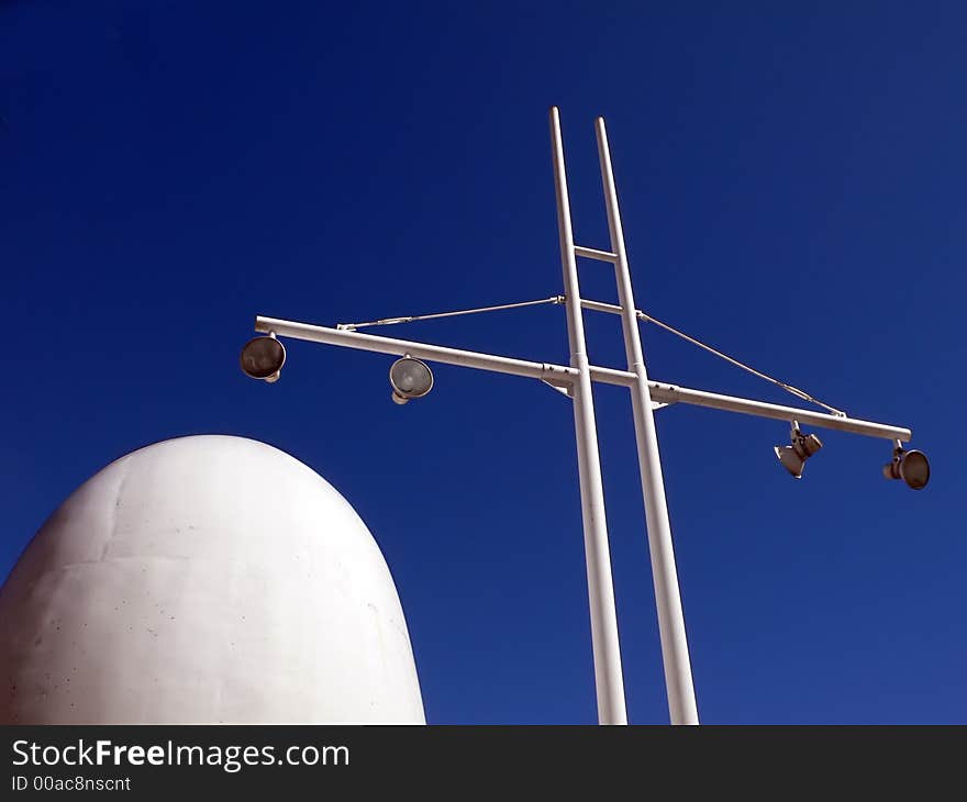 Abstract modern harbor architectural elements: lamp mast and marine ship power pipe. Abstract modern harbor architectural elements: lamp mast and marine ship power pipe