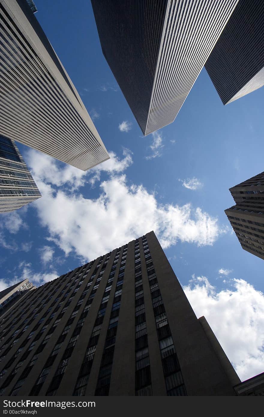 Modern skyscrapers against a bright blue sky