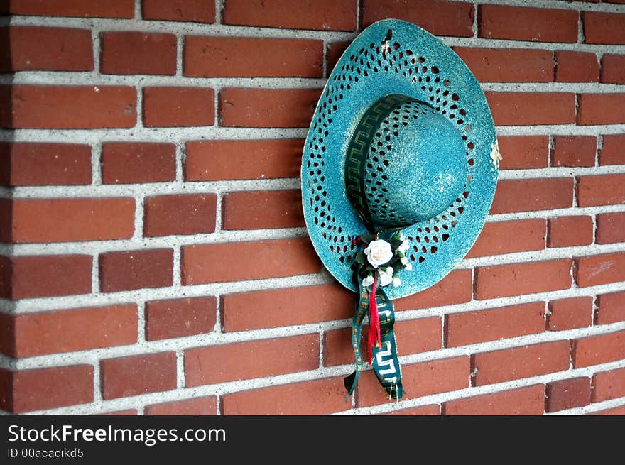 A blue hat on the wall