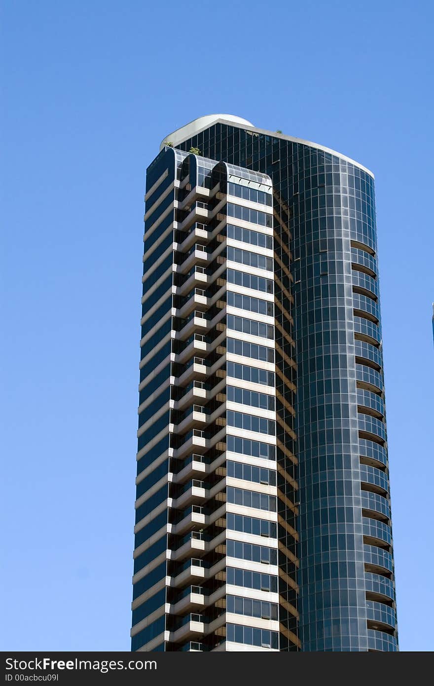 Modern skyscrapers against a bright blue sky