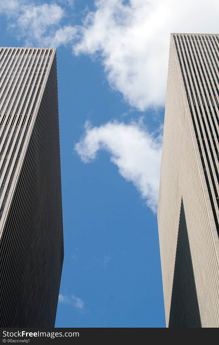 Modern skyscrapers against a bright blue sky