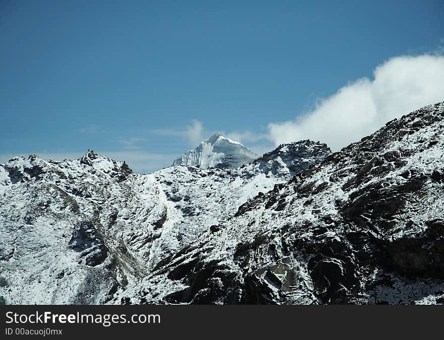 Snowcowered high cordillera mountain and clouds. Snowcowered high cordillera mountain and clouds