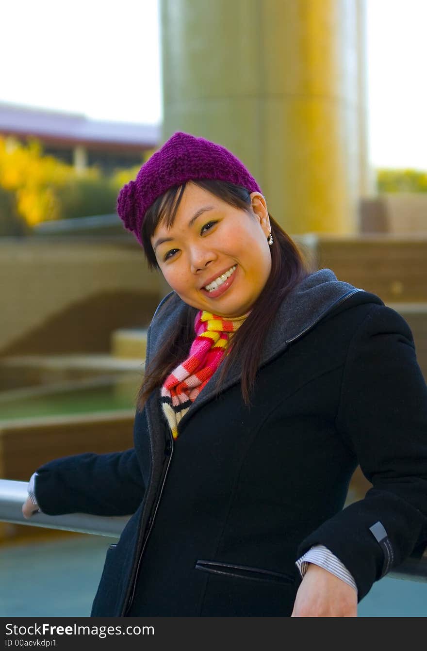 Happy young asian girl in winter clothes