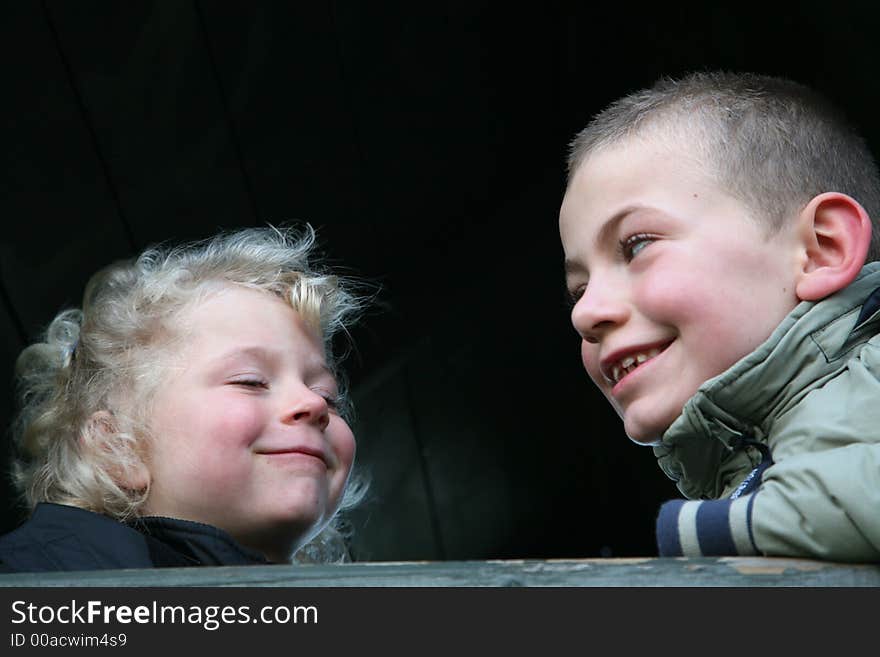 Family: brother and sister smiling and having fun