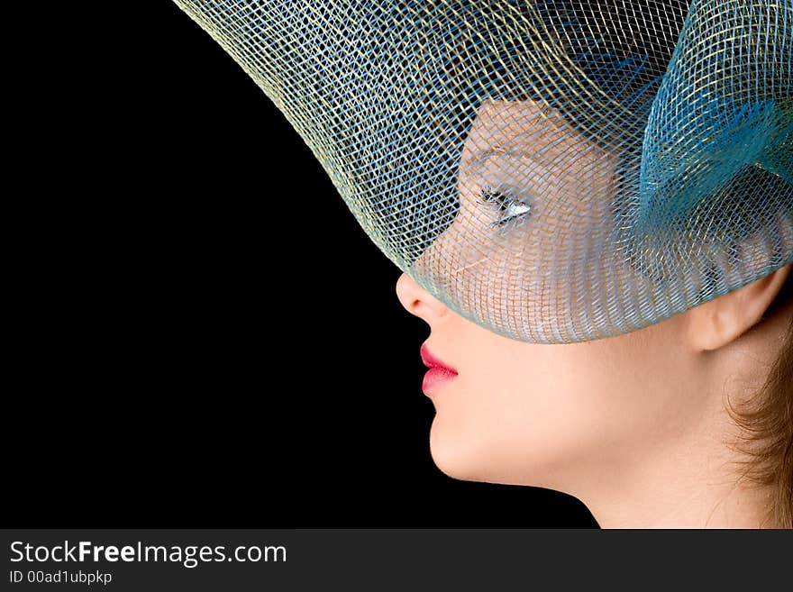 Profile of woman with stylish grid as a hat. Profile of woman with stylish grid as a hat