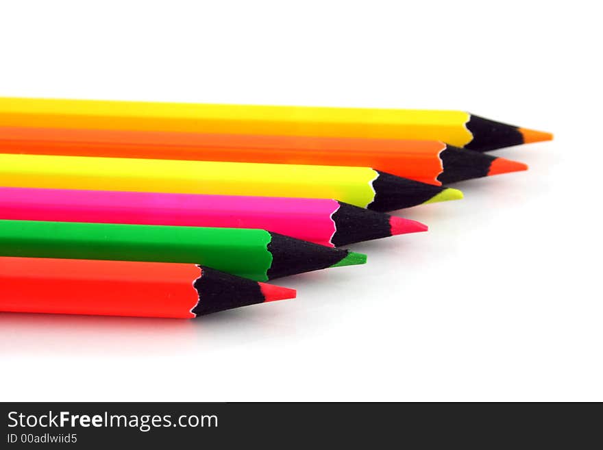 Neon Pencils in a line on a white background. Neon Pencils in a line on a white background