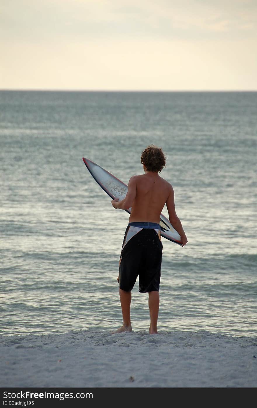 Boy surfer on Florida beach