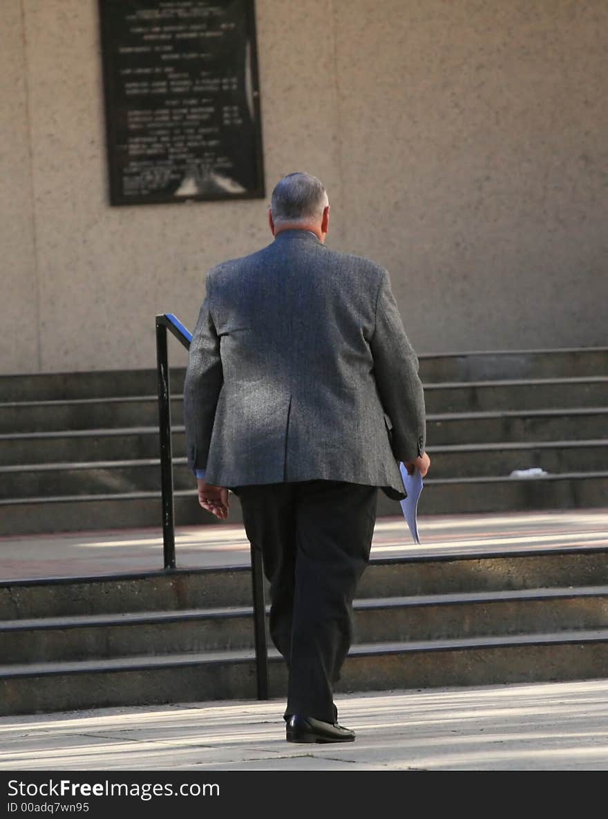 Attorney walking up to the courthouse. Attorney walking up to the courthouse