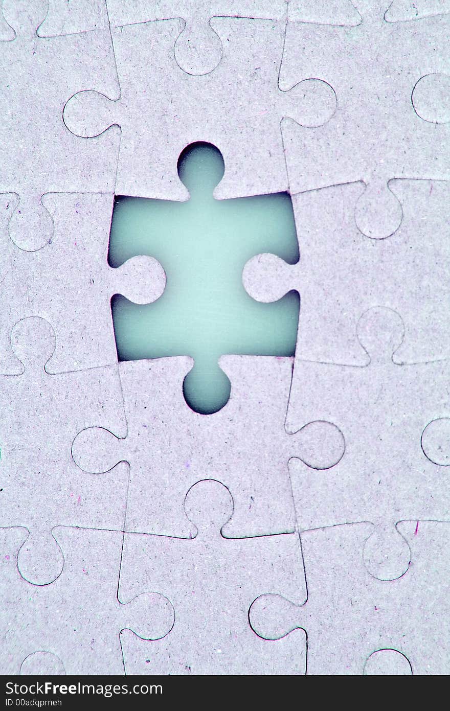 A jigsaw puzzle with a missing piece.