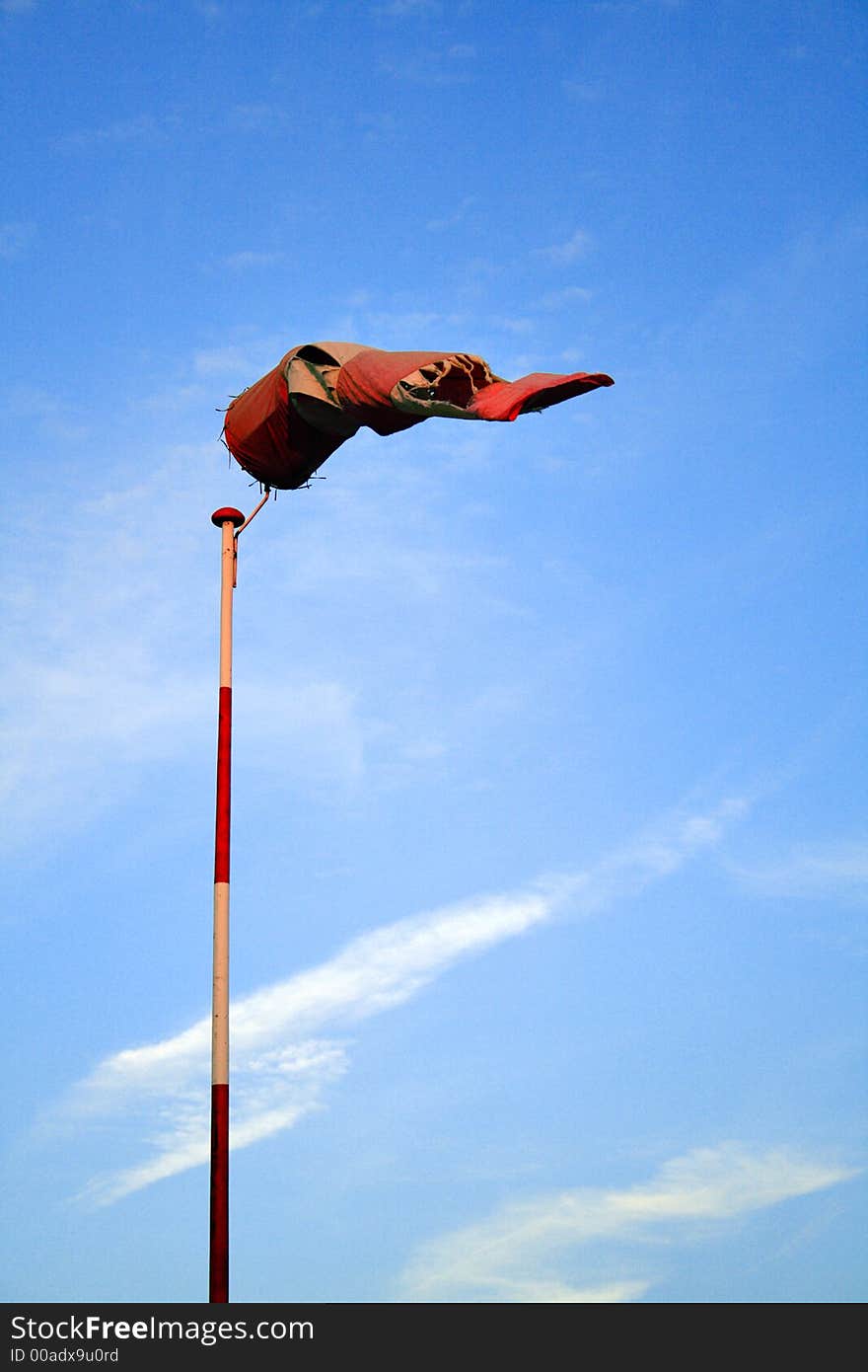 Torn windcone on a pole. Torn windcone on a pole