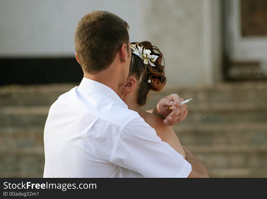 The girl and the guy with a cigarette. The girl and the guy with a cigarette