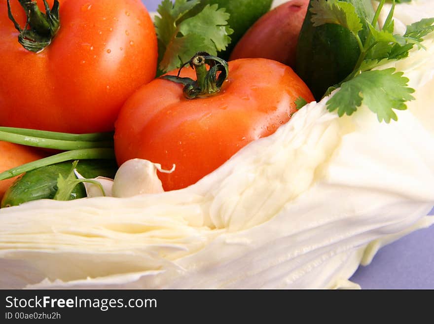 Ingredients for salad on a light blue background. Ingredients for salad on a light blue background.