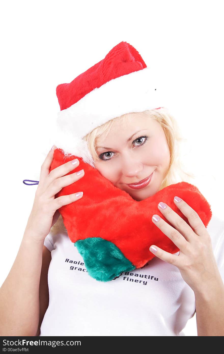 Young beautiful woman in a santa's cap smiling. Isolated on white. Young beautiful woman in a santa's cap smiling. Isolated on white.