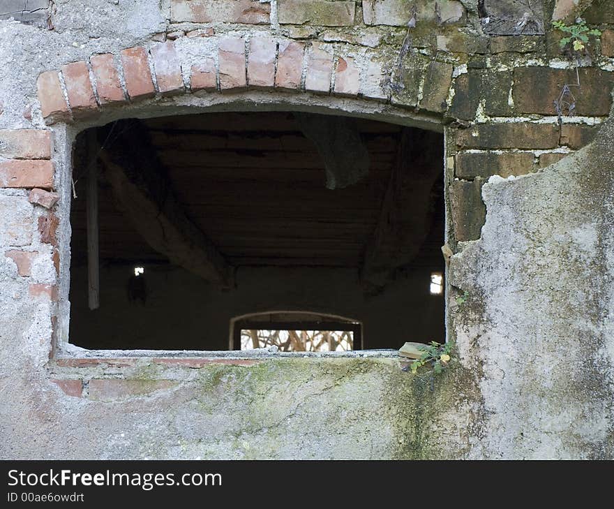 Old empty window on the very old stone wall. Old empty window on the very old stone wall