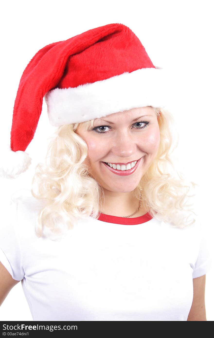 Young beautiful woman in a santa's cap smiling. Isolated on white. Young beautiful woman in a santa's cap smiling. Isolated on white.