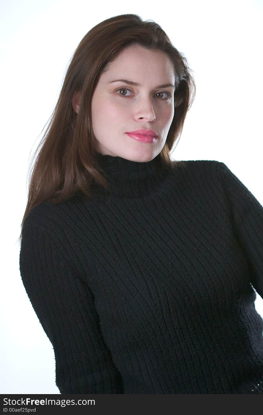 Pretty young brunette in black sweater looking straight at the camera