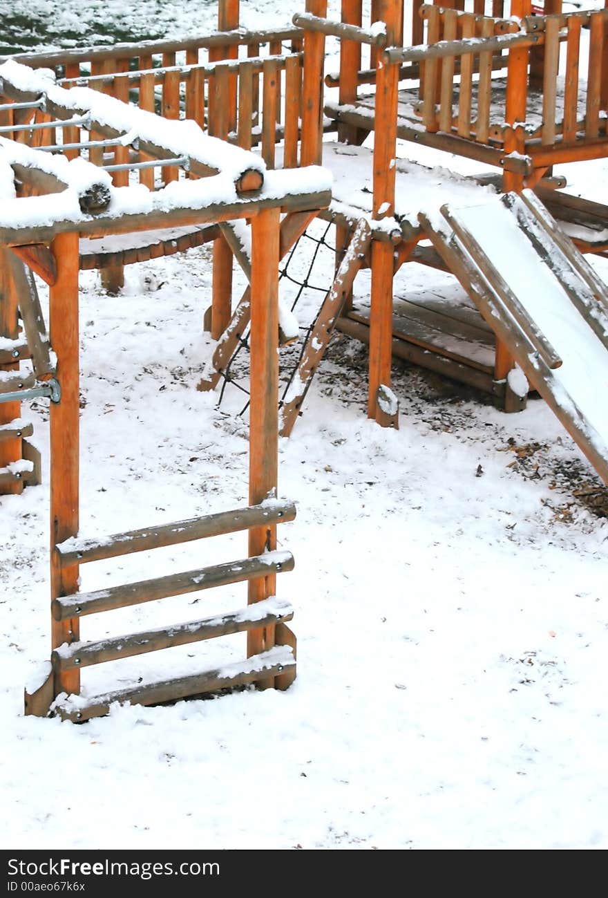 Playground in the snow season.