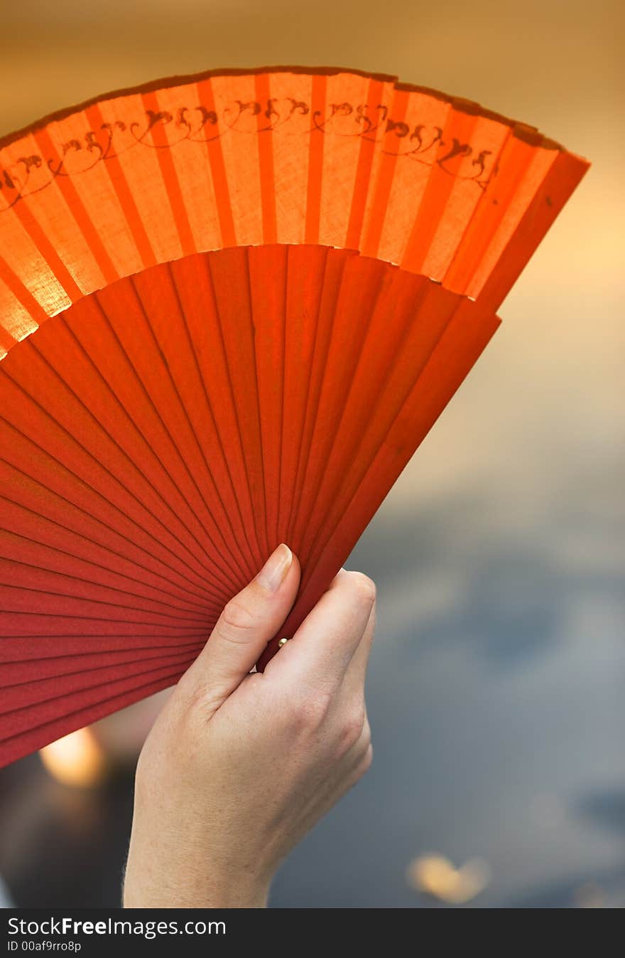 Female Holding A Fan