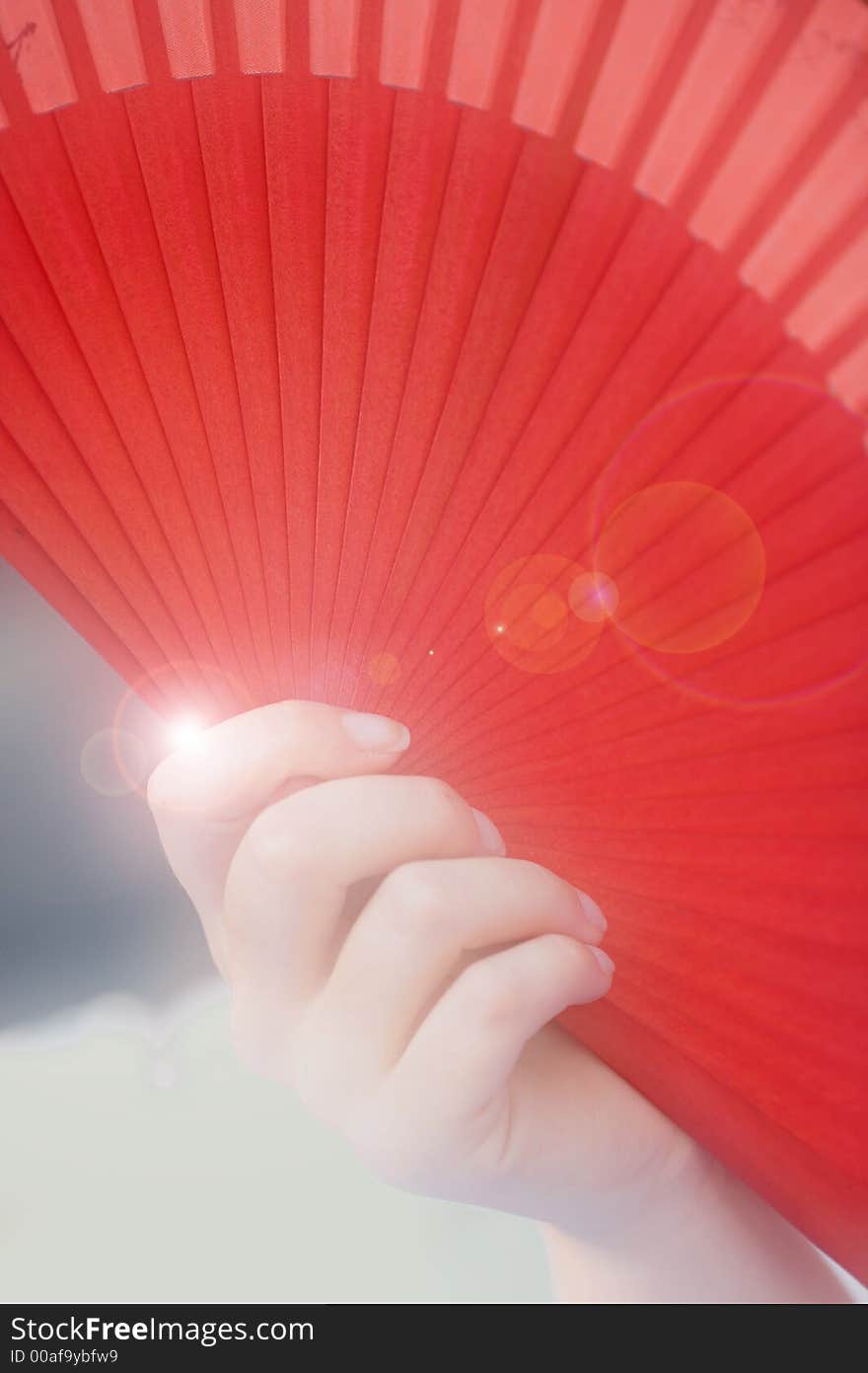 Female holding a fan