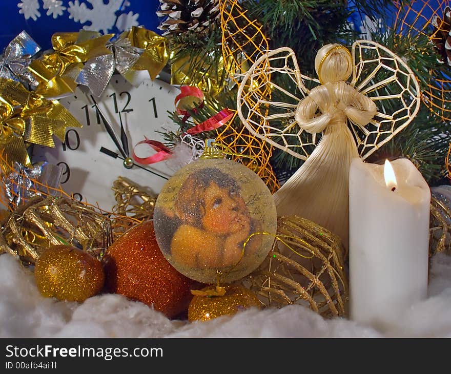 Christmas - New Year composition with wicker angel figure, Christmas tree toys, candle, clock. Christmas - New Year composition with wicker angel figure, Christmas tree toys, candle, clock