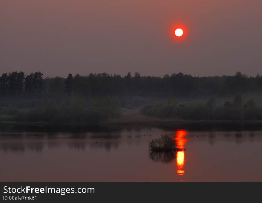 Sunset on the lake in the summer time