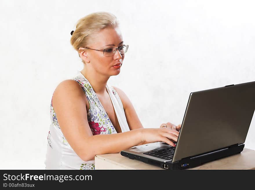 Blond businesswoman working with notebook