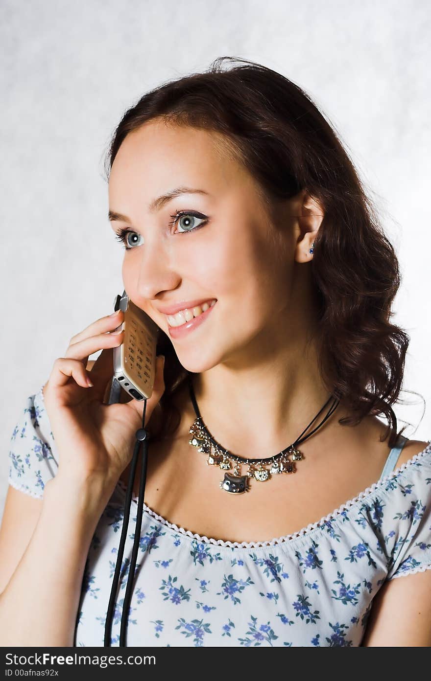 Attractive young woman calling by phone. Attractive young woman calling by phone