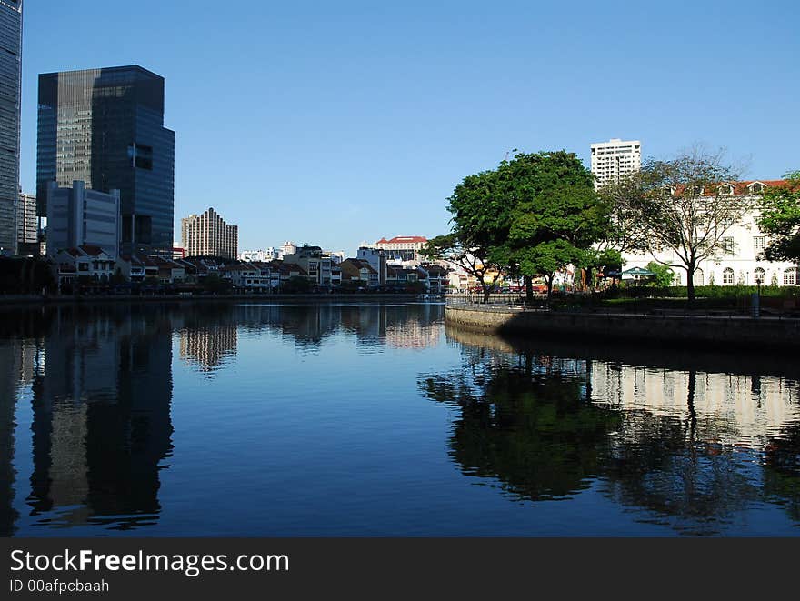 water reflection of modern building and trees . water reflection of modern building and trees