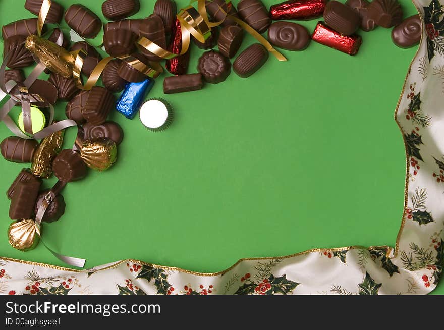 Fine chocolate on green background , christmas ribbon. Fine chocolate on green background , christmas ribbon