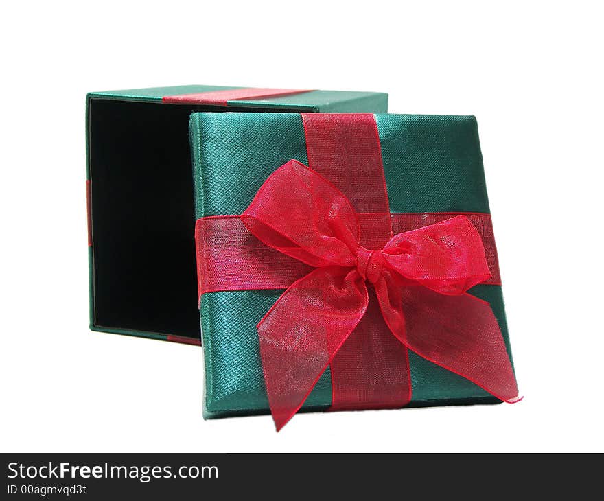 Photo of a christmas present with the lid tilted on top of it, isolated on a white background. Photo of a christmas present with the lid tilted on top of it, isolated on a white background