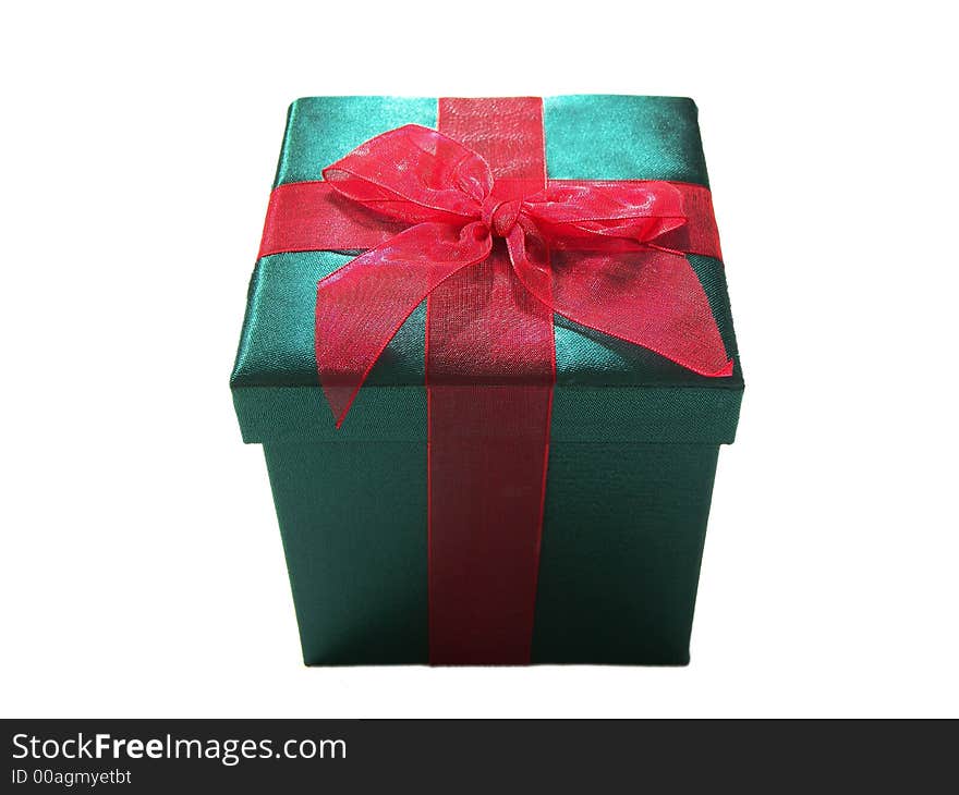 Photo of a green christmas present with a red bow isolated on a white background. Photo of a green christmas present with a red bow isolated on a white background