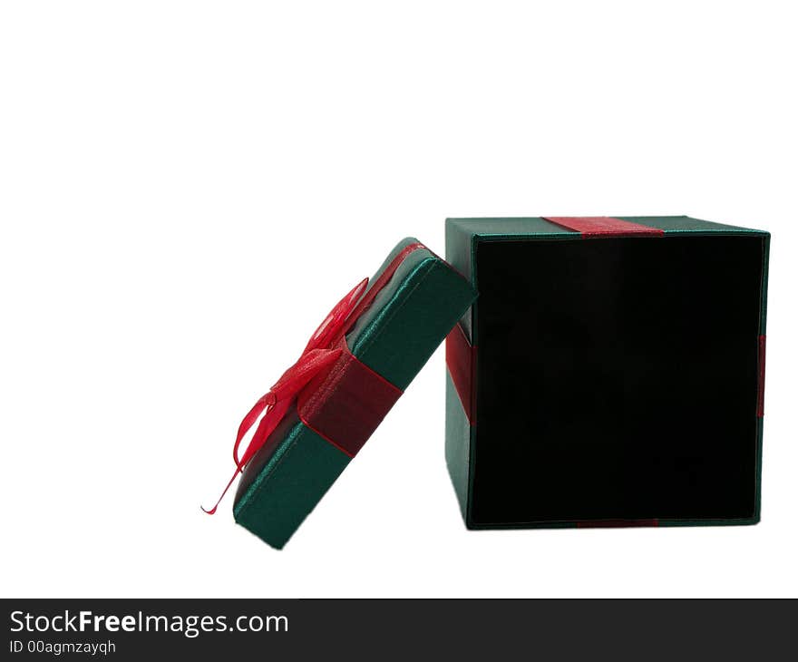 Photo of a green christmas present with a red bow isolated on a white background. Photo of a green christmas present with a red bow isolated on a white background