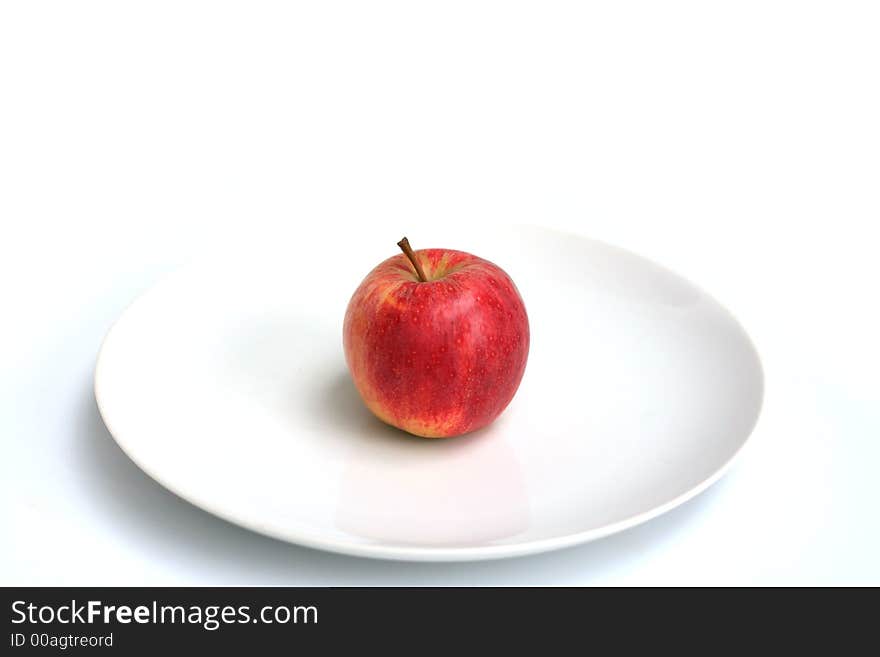 Apples shot in various setups on a white plate