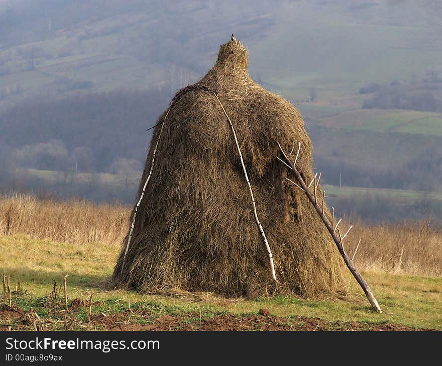 A picture of large haystack on the autumn field