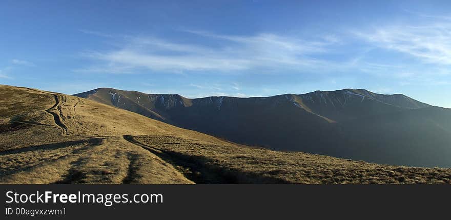 Panoramic picture of mountain range in the evening. Panoramic picture of mountain range in the evening